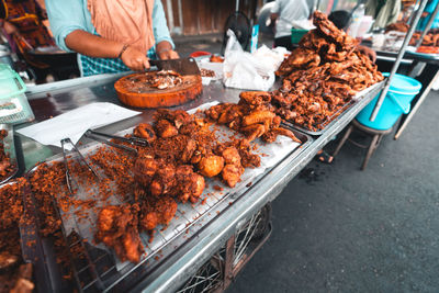 Man preparing food on barbecue grill