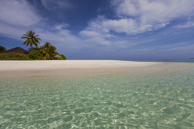 Picturesque view tiny tropical island surrounded by azure clear water lagoon, maldives