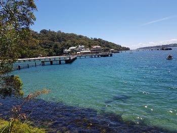 Scenic view of sea against clear blue sky