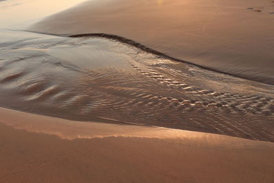 High angle view of sand dunes at beach