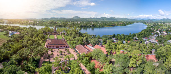 High angle view of trees and buildings against sky