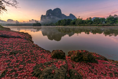 Scenic view of lake against sky during sunset