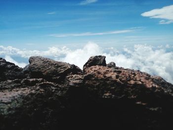 Low angle view of rock formation against sky