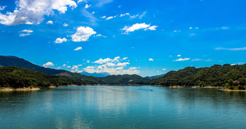 Scenic view of lake against blue sky