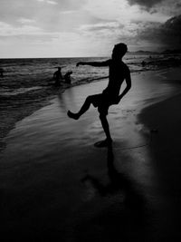 People on beach at sunset