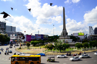 People in city against sky