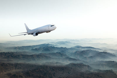 Airplane flying against sky