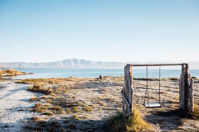 Scenic view of beach against clear sky