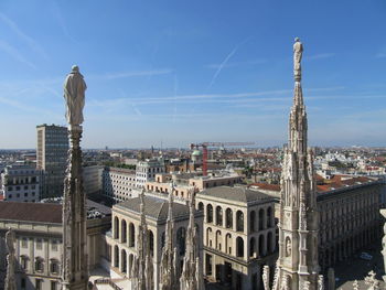 High angle shot of townscape against blue sky