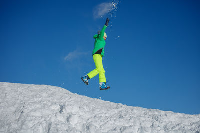 Full length of man skiing on snow