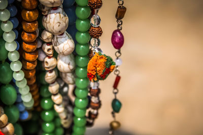 Close-up of multi colored jewelry for sale in market