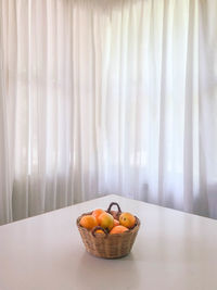 Fruits in bowl on table