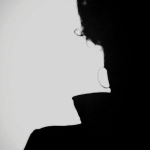 Close-up of silhouette man against white background