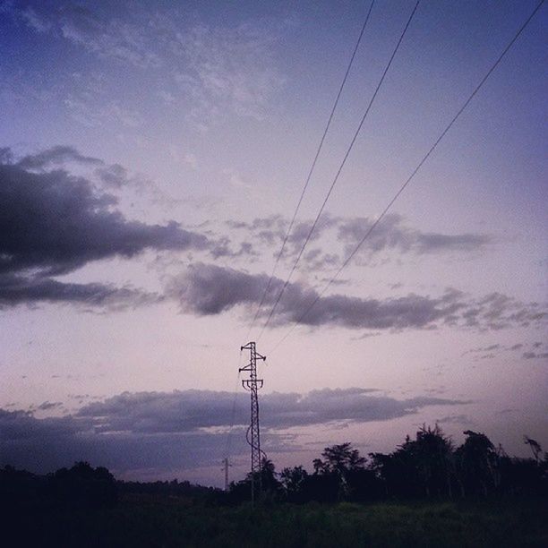 electricity pylon, power line, electricity, power supply, sky, fuel and power generation, silhouette, connection, cable, technology, tranquility, low angle view, cloud - sky, tranquil scene, tree, scenics, beauty in nature, nature, landscape, sunset