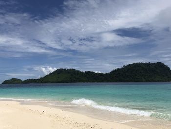 Scenic view of beach against sky