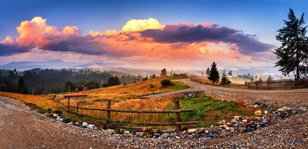 Scenic view of field against sky during sunset