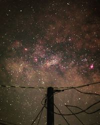 Low angle view of illuminated stars against sky at night