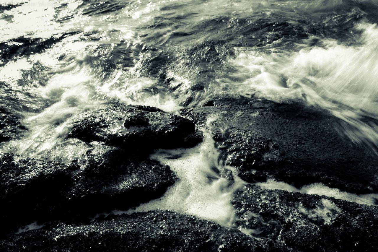 water, motion, surf, splashing, power in nature, flowing water, waterfall, rock - object, long exposure, wave, nature, beauty in nature, sea, high angle view, flowing, scenics, blurred motion, rock formation, day, outdoors