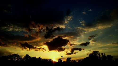 Low angle view of dramatic sky during sunset