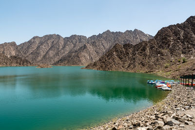 Scenic view of rocks and mountains against clear sky