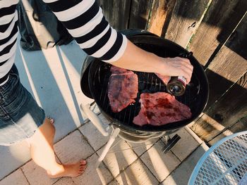 Low section of person preparing food on table