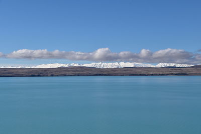 Scenic view of sea against blue sky