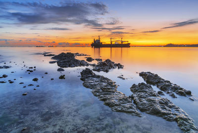 Scenic view of sea against sky during sunset