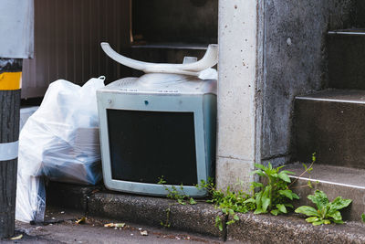 Abandoned computer monitor by steps