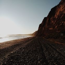 Scenic view of beach against clear sky