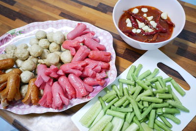 High angle view of chopped vegetables in bowl on table