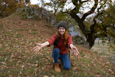 Portrait of smiling young woman in hat