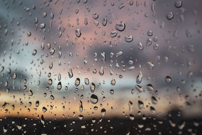 Close-up of raindrops on glass window