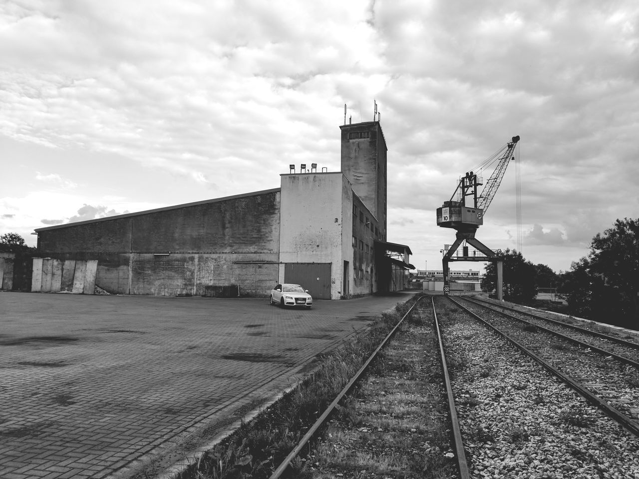 railroad track, transportation, sky, rail transportation, cloud - sky, day, mode of transport, built structure, freight transportation, outdoors, architecture, no people, building exterior