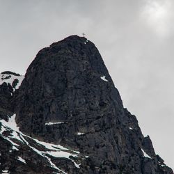 Low angle view of rock formations against sky