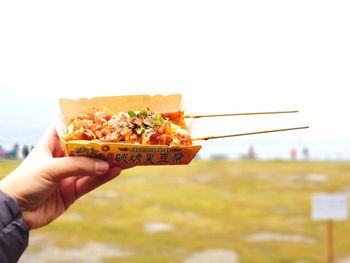 Close-up of hand holding food