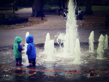 Full length of a boy standing in water