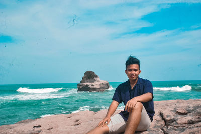 Portrait of young man on beach