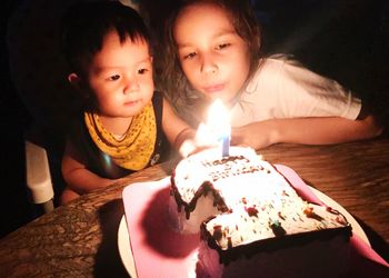 High angle view of mother and girl holding ice cream