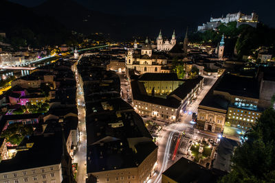 High angle view of city buildings at night