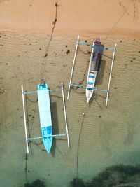 Deck chairs on sand at beach