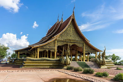 Temple against cloudy sky