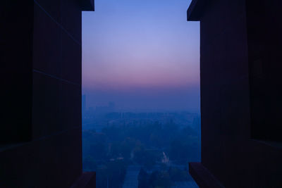 Silhouette of building at sunset