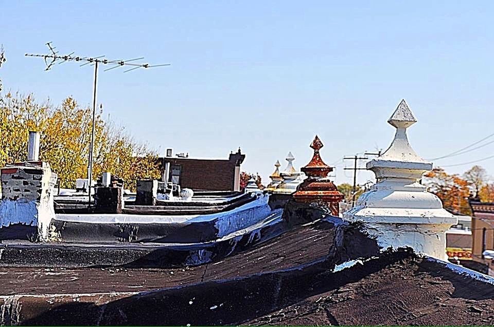 VIEW OF FOUNTAIN WITH BUILDINGS IN BACKGROUND