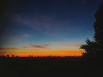 Scenic view of silhouette landscape against sky at sunset