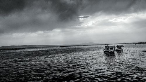 Scenic view of sea against cloudy sky