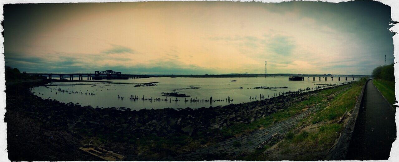 transfer print, auto post production filter, sky, transportation, cloud - sky, landscape, tranquil scene, tranquility, nature, water, scenics, field, road, cloudy, beauty in nature, outdoors, cloud, connection, weather, no people