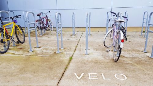 Bicycles parked at metallic rack