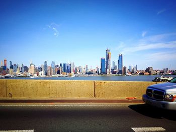 City by buildings against sky
