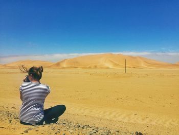 Scenic view of desert against clear sky