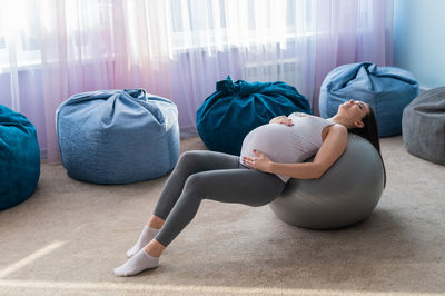 Rear view of woman exercising in gym